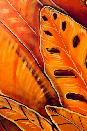 Colorful abstract mural featuring vibrant orange and yellow autumn leaves.